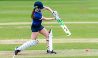 girl playing cricket
